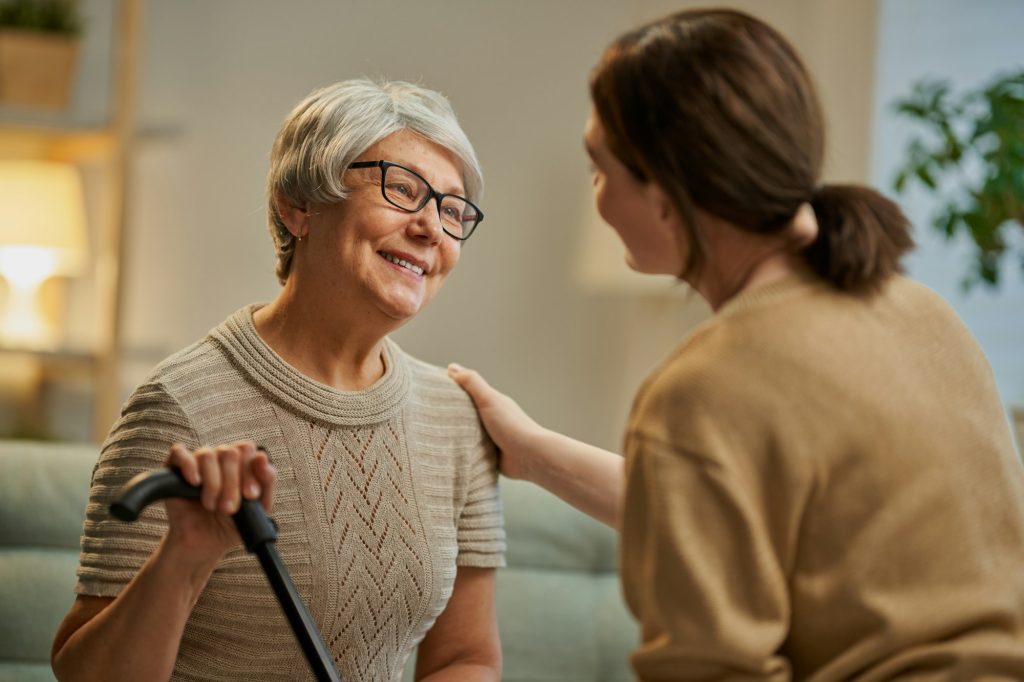 Happy client laughing with her carer